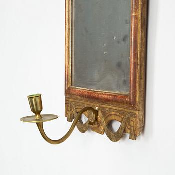 A  Gustavian giltwood one-light girandole mirror by N. Sundström (master in Stockholm 1754-1781).