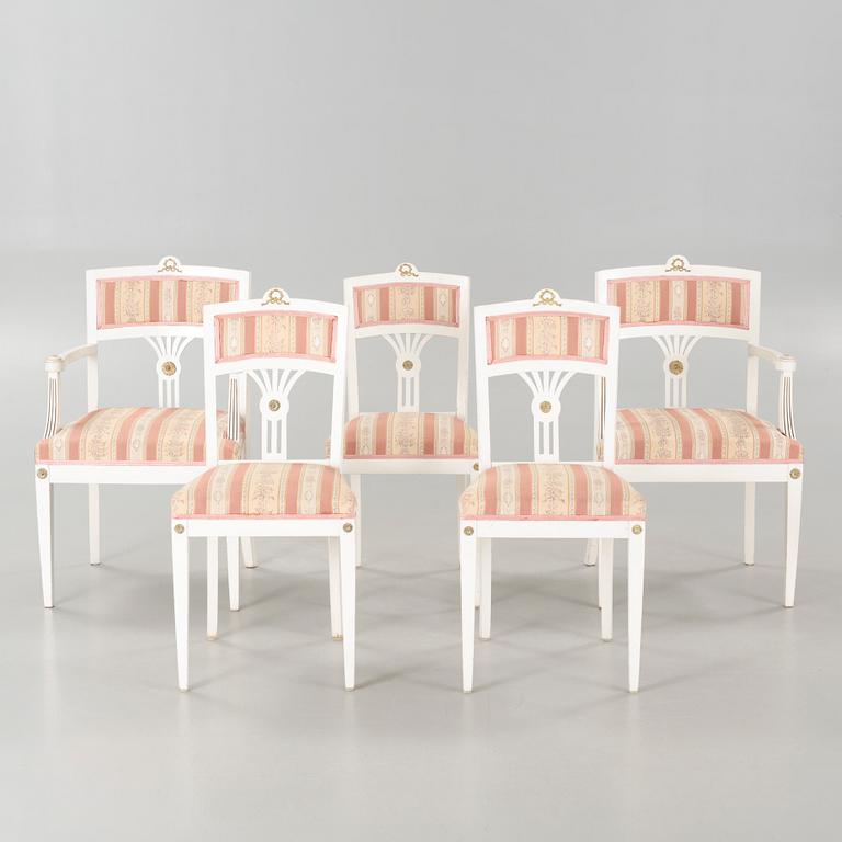 Two gustavian style armchairs and three chairs, first half of the 20th century.