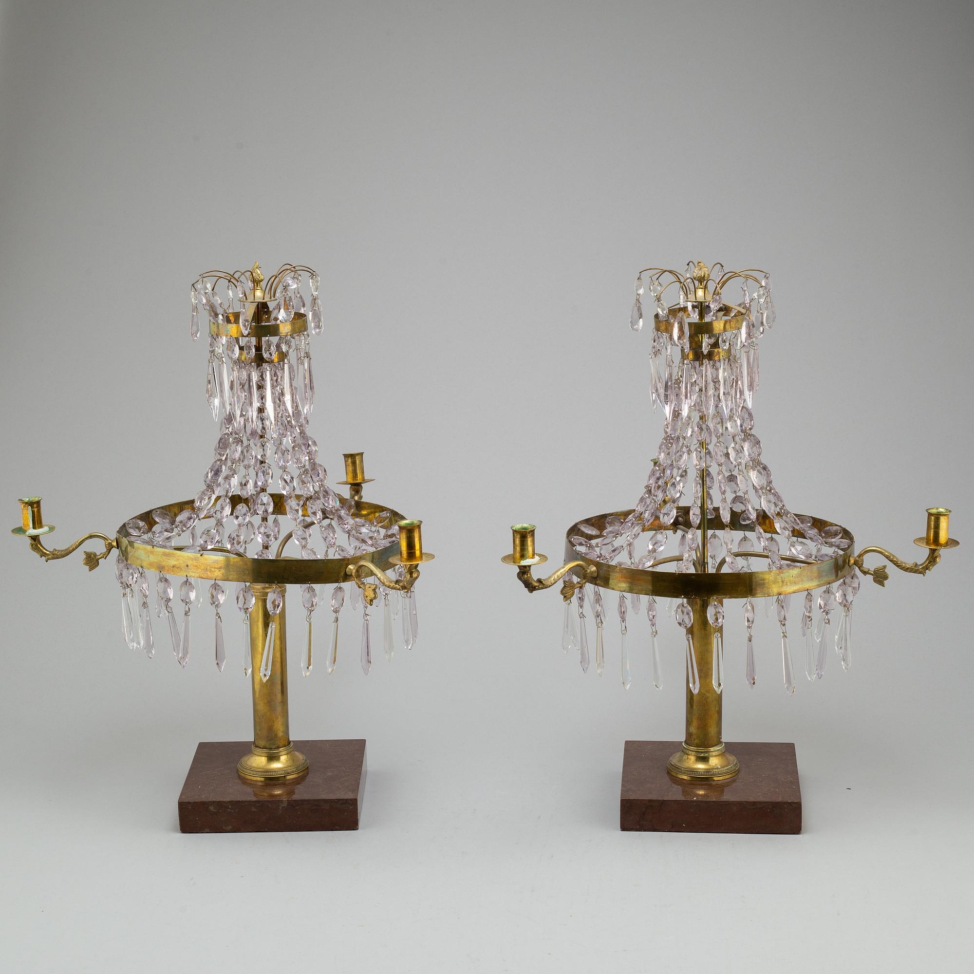 A pair of late Gustavian style three-light candelabra.
