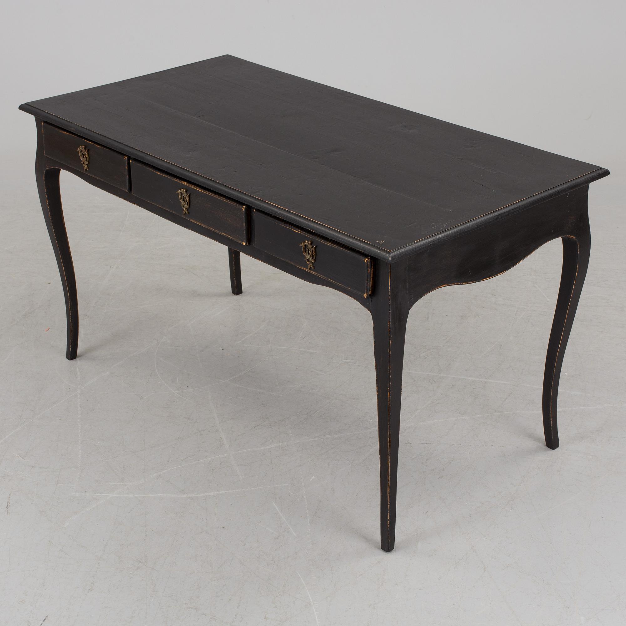 A partially rococo, 18th century writing desk.
