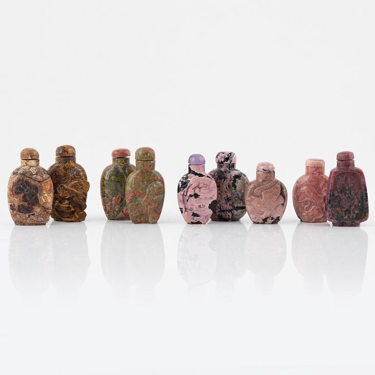 Nine Chinese snuff bottles in mottled stone, 20th century.
