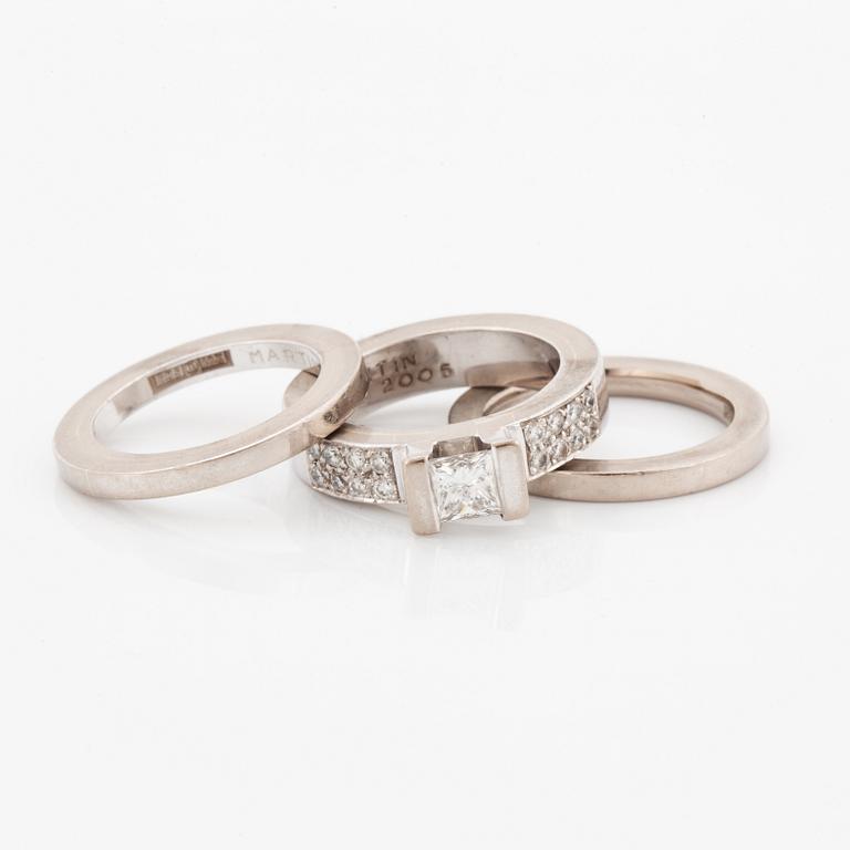 Rolf Karlsson, Three rings, 18K white gold with princess-cut and brilliant-cut diamonds, and two band rings.