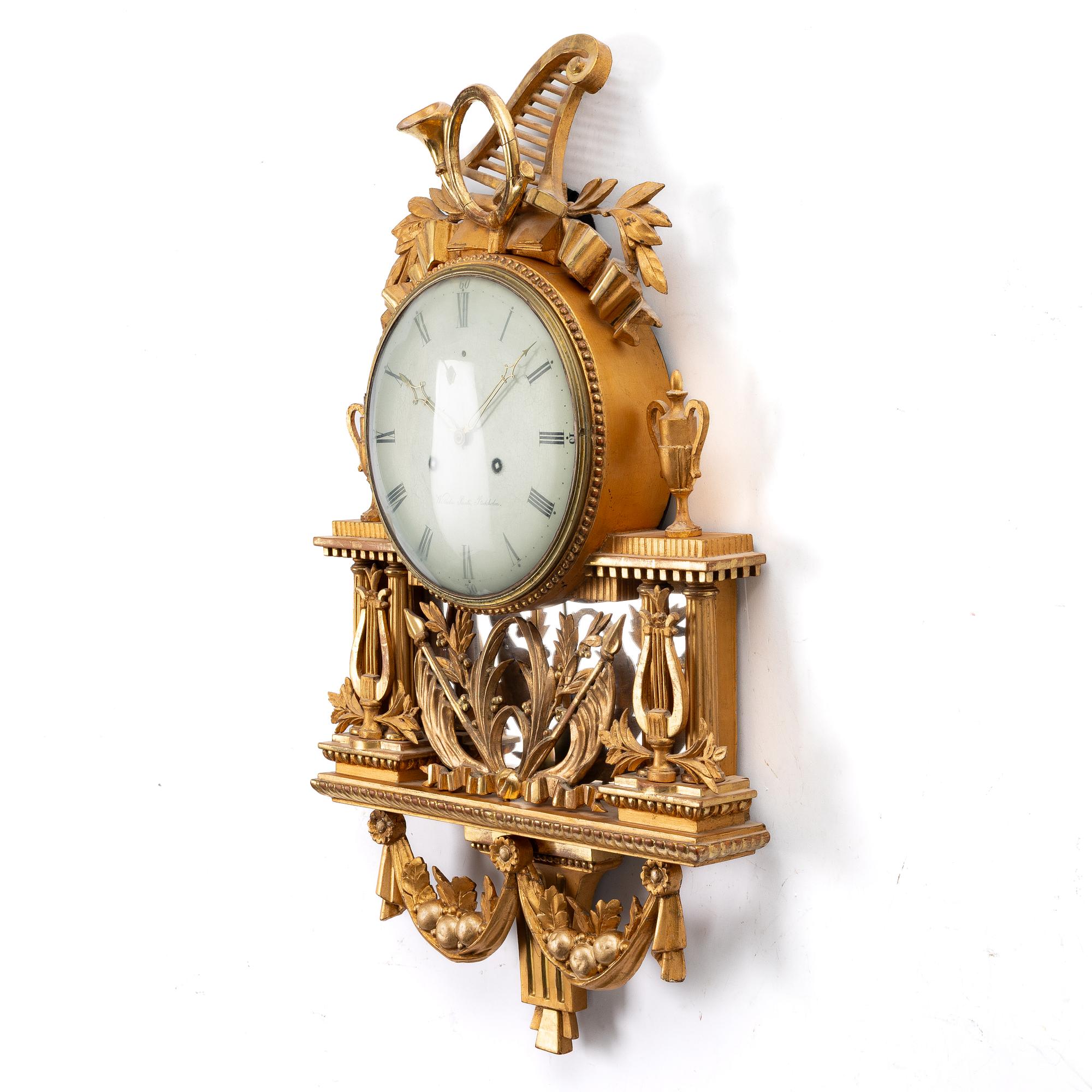 Wall-mounted clock, gilt, dial signed Wilhelm Pauli, Stockholm (active 1795–1816).
