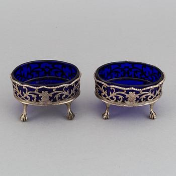 A pair of English 18th century silver and blue glass salt-cellars, unidentified makers mark, London 1767.