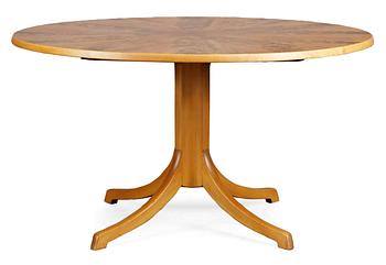 103. A Carl Malmsten mahogany and walnut dinner table, 1940's-50's.