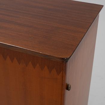 A beech and mahogany mid 20th century cabinet.