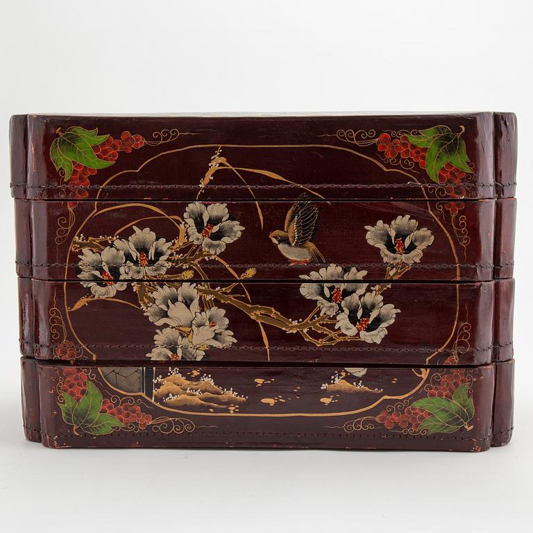 A painted Japanese four tiered box, 20th Century.
