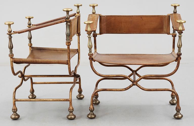 A pair of Italian neo-classical iron and brass
easy chairs, Italy mid 20th C.