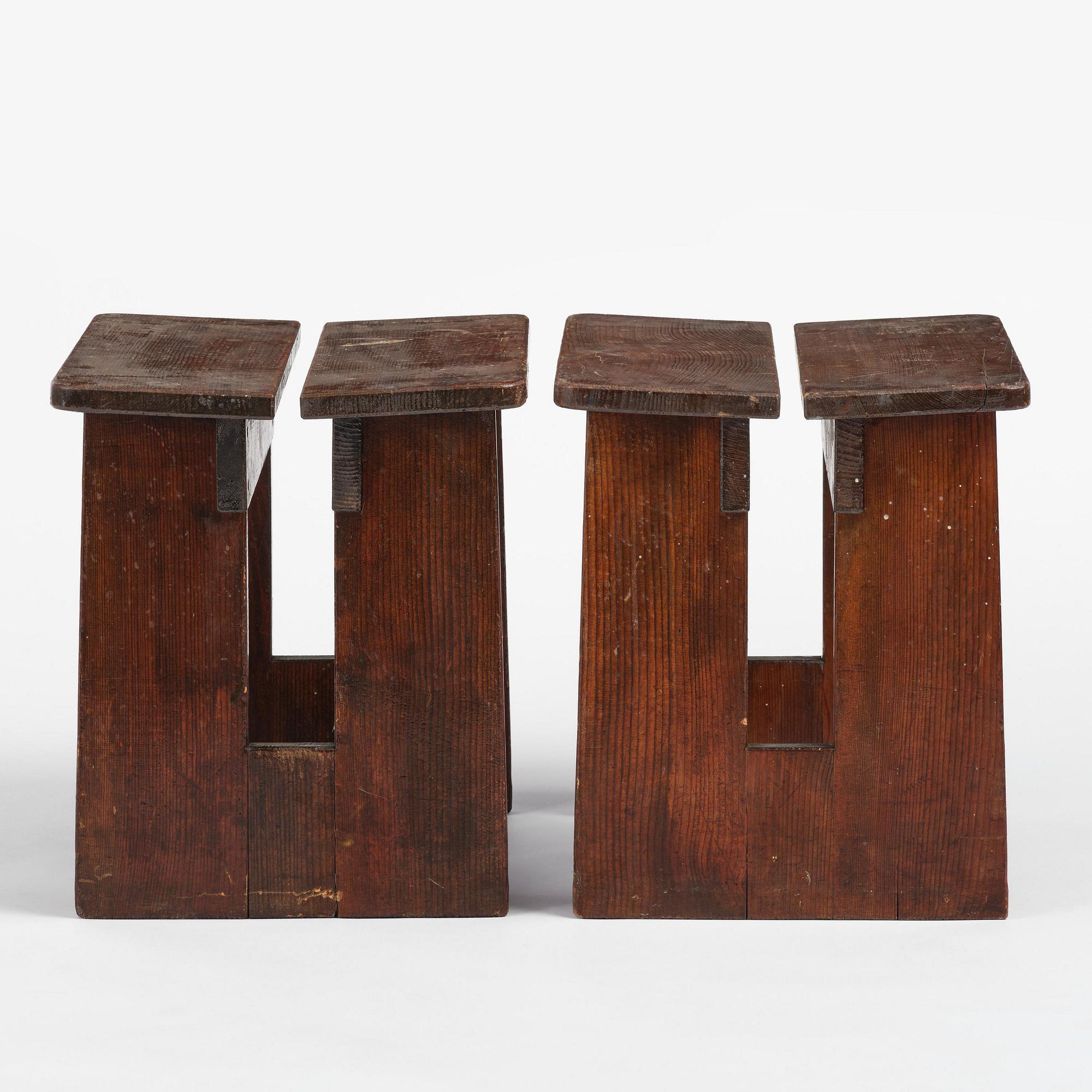 Axel Einar Hjorth, a pair of stained pine "Skoga" stools, Nordiska Kompaniet, Sweden, 1930s.