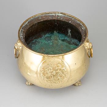 A 19th century brass flower pot.