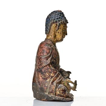 A seated bronze figure of buddha, Ming dynasty (1368-1644).