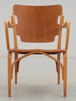 A Carl-Axel Acking mahogany and beech armchair, Svenska Möbelfabrikerna, Bodafors, Sweden 1940's.