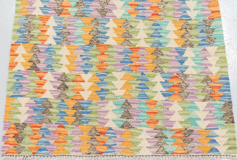 A runner, kilim, ca 391 x 80 cm.
