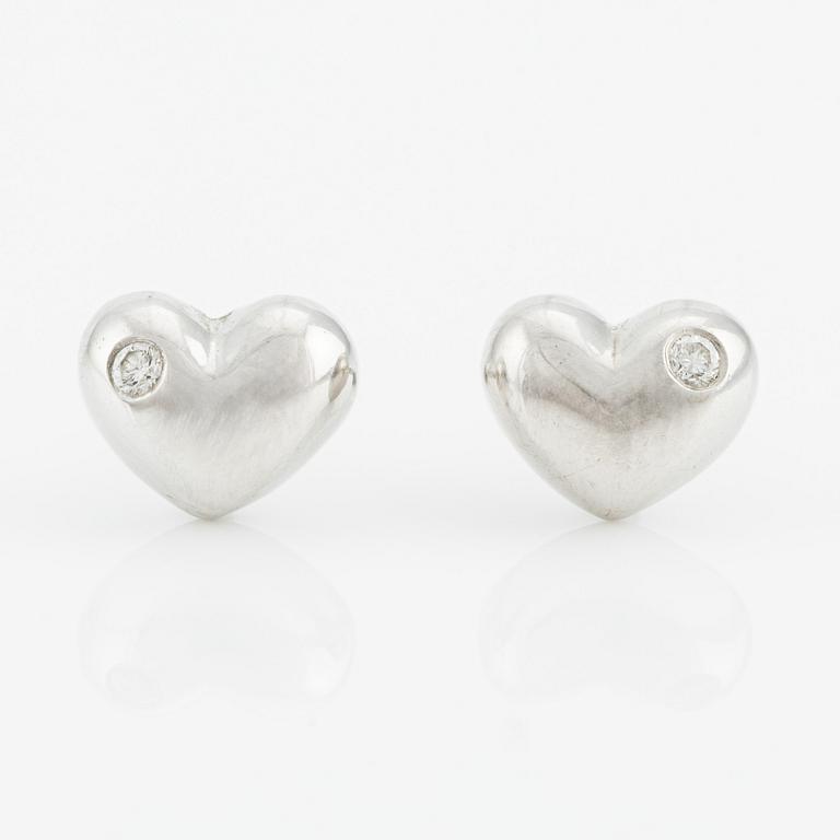 Ole Lynggaard a pair of heart-shaped earrings.