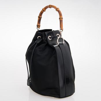 GUCCI, a black nylon handbag.