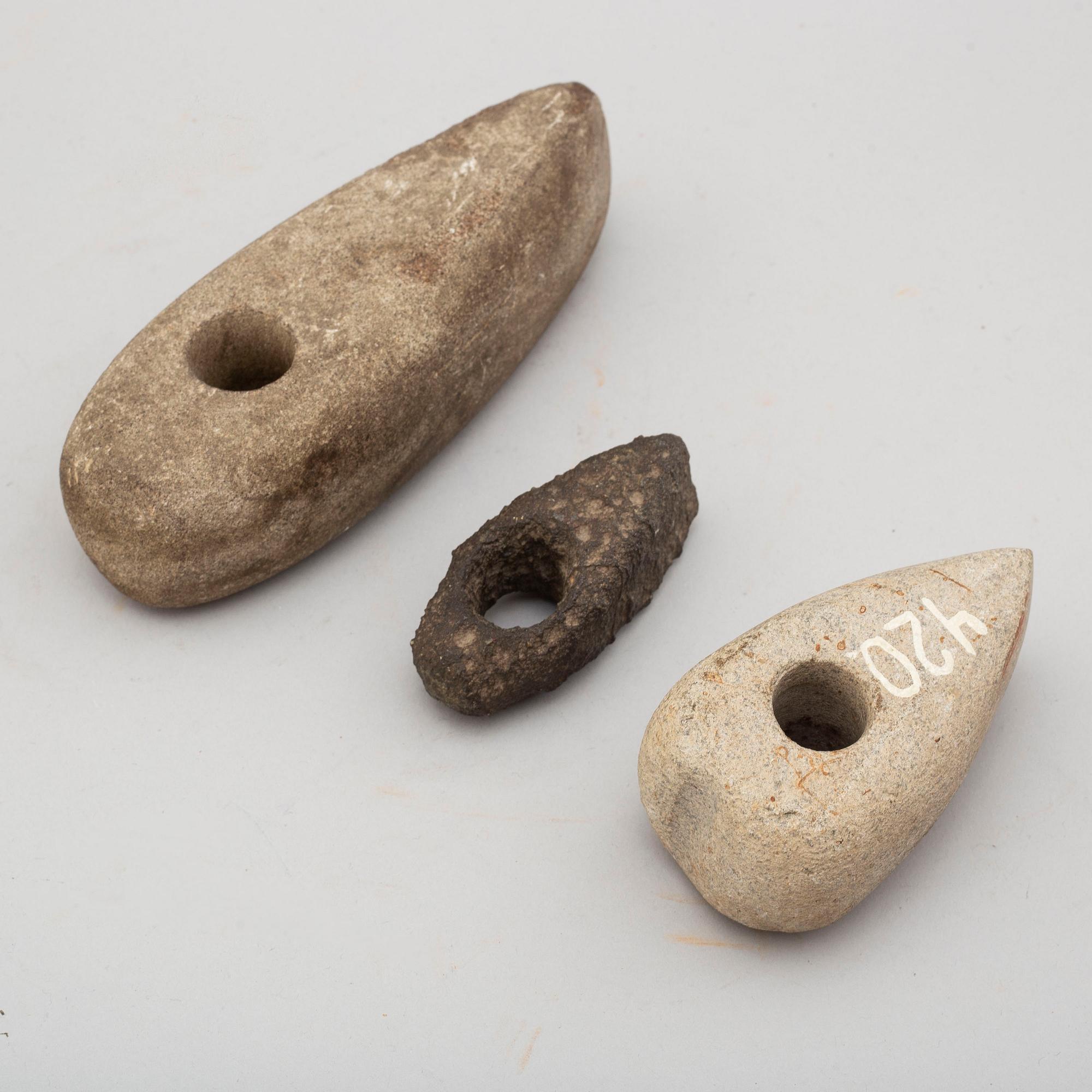 Three neolithic stone axes.