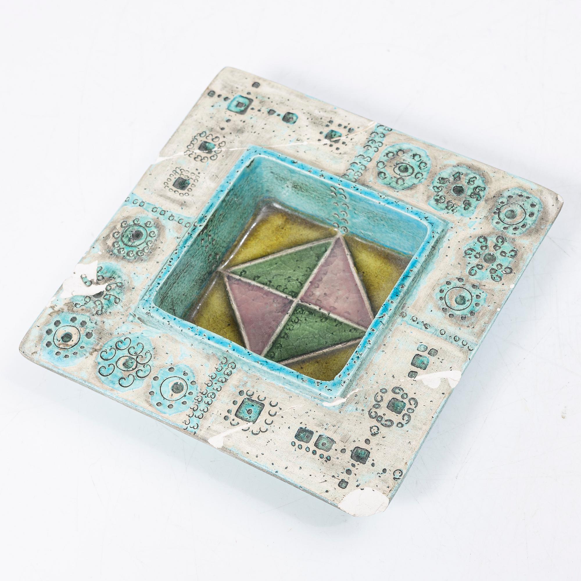 Rut Bryk, plates, as well as plate/wall relief, stoneware.