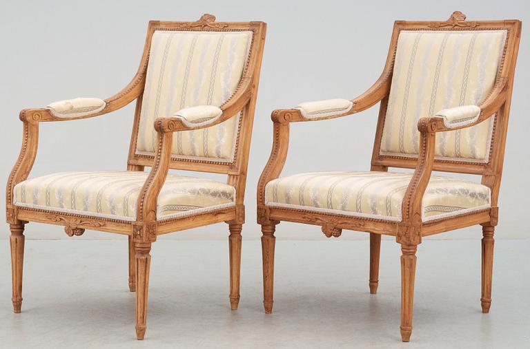 A Gustavian 18th century suite of furniture comprising a pair of armchairs and a sofa.