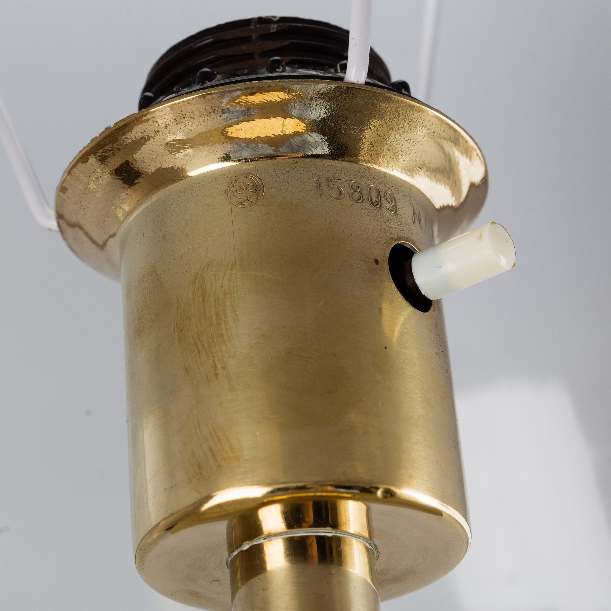 A second half of the 20th Century pair of pine and brass table lights.