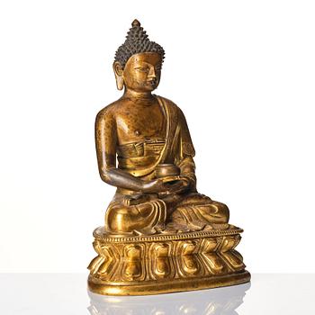 A gilt-bronze figure of Amitabha Buddha, Tibet, 17/18th century.