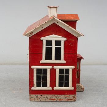 a dolls cabinet, dated 1940.