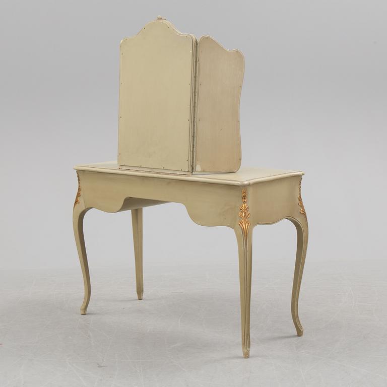 A mid 20th century Rococo style dressing table, a pair of bedside tables and one stool.