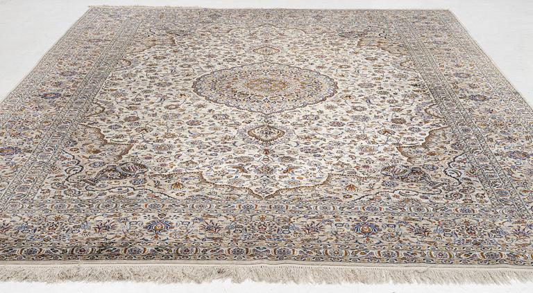 A semi-antique silk Keshan carpet, c. 350 x 248 cm.