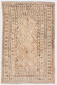 A Kilim carpet, ca. 305 x 196 cm.