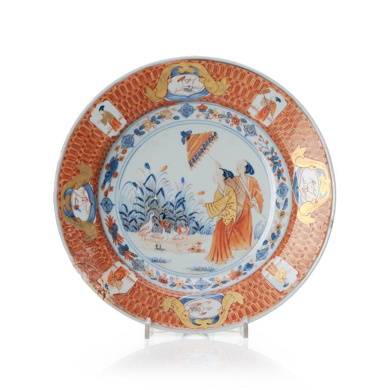 Chinese Imari ’Dame au Parasol’ plate decorated in underglaze blue, iron-red and gilt, Qing dynasty, Qianlong 1730-40.