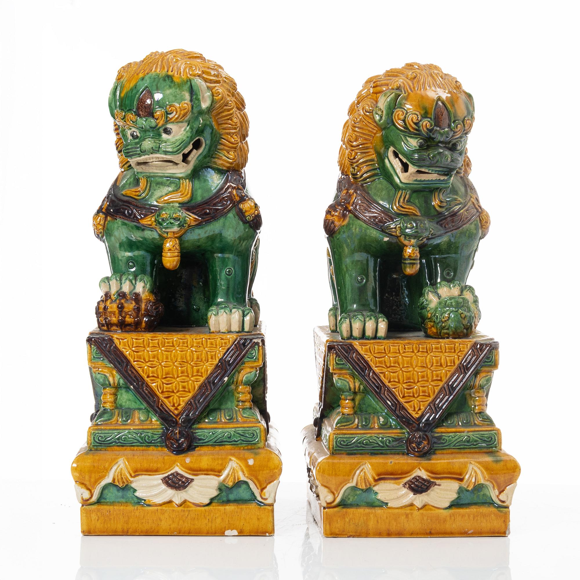 A pair of large figures of buddhist lions, China, second half of the 20th Century.