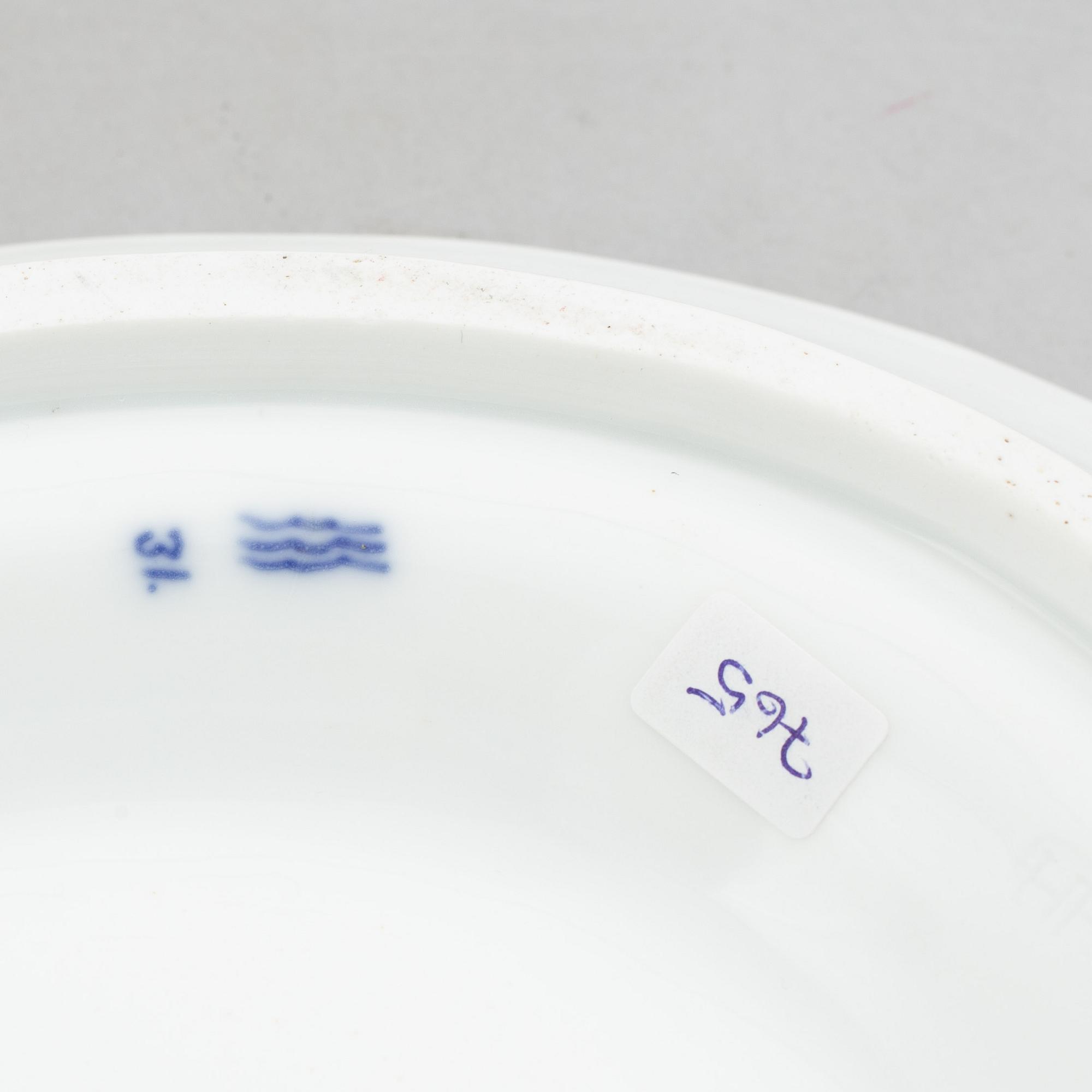 A porcelain 'Blue fluted half lace' / 'Musselmalet' tureen with cover and stand, Royal Copenhagen, 19th century.