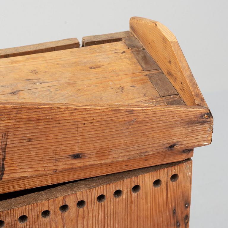 A late 19th century pine cupboard for eggs.