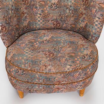 A pair of mid-20th century armchairs.