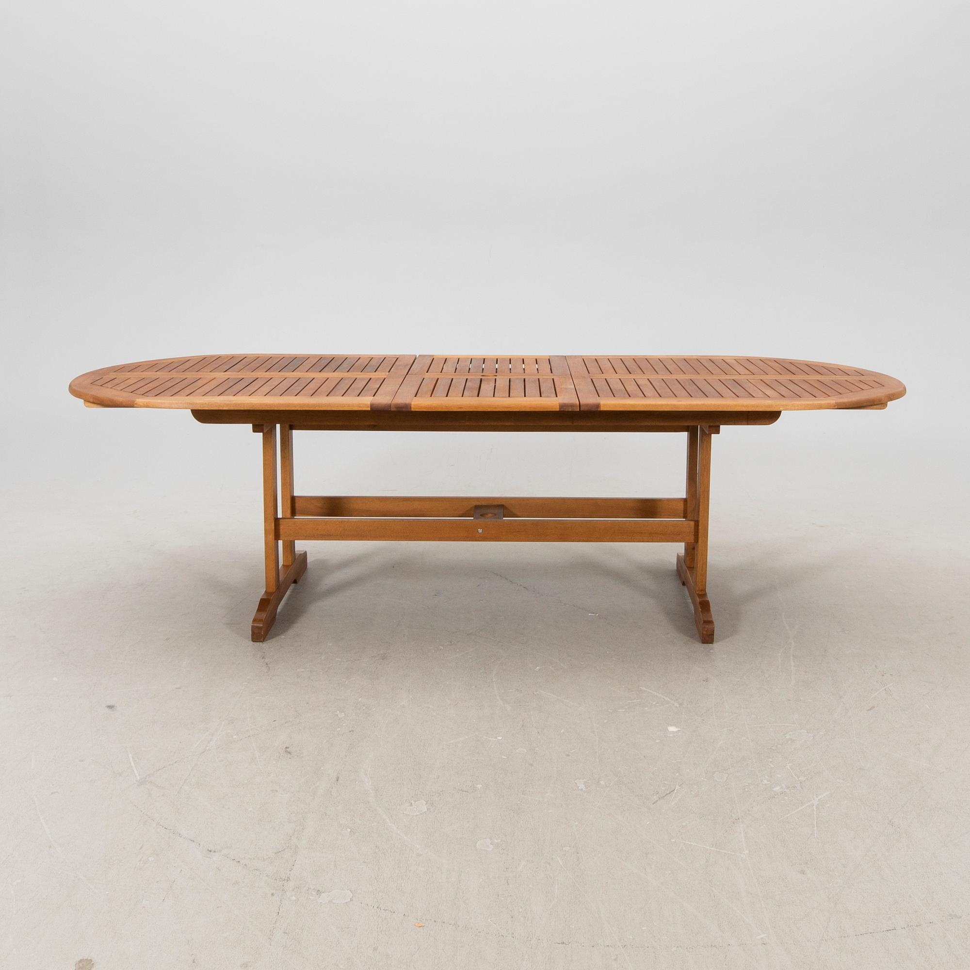 A 9 pcs stained teak garden suite by Brafab around 2000.