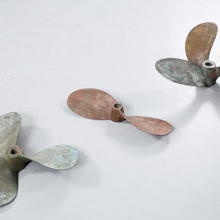 Four 20th century bronze propellers.