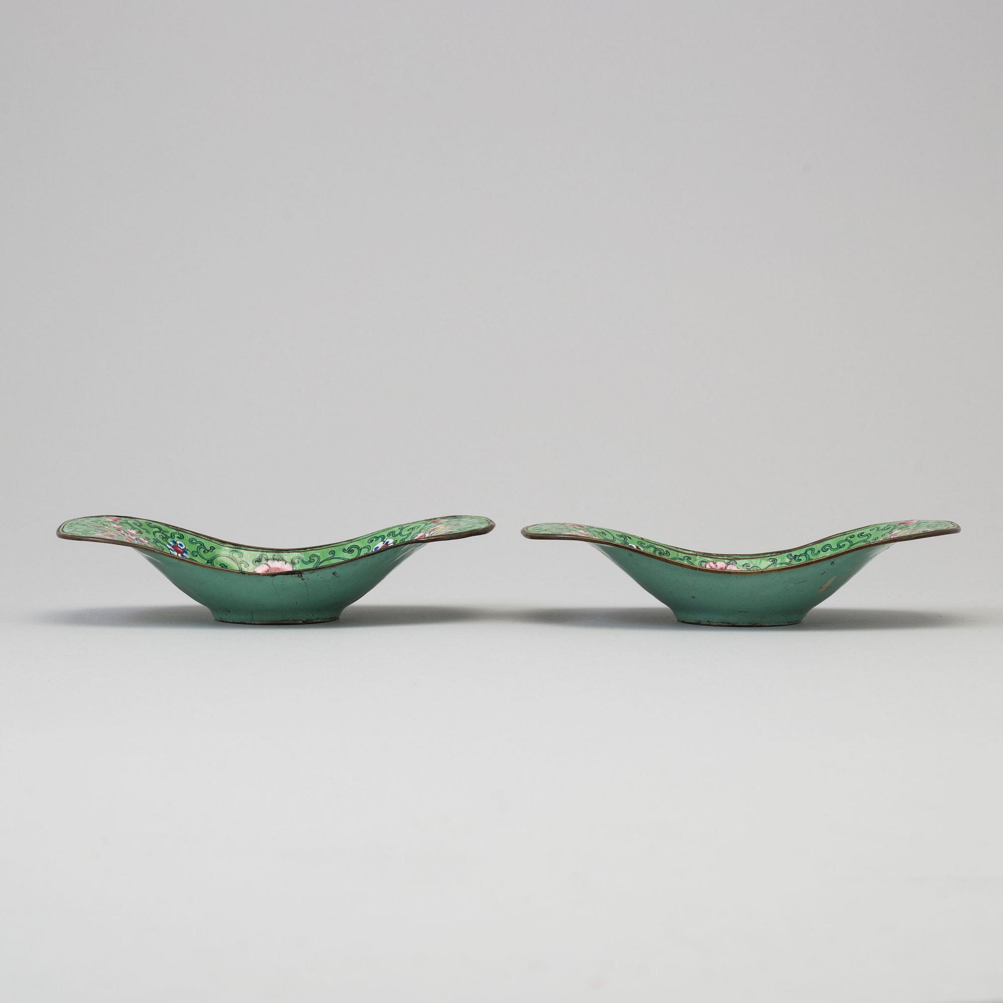 A pair of circa 1900 Qing dynasty enamel saucers.