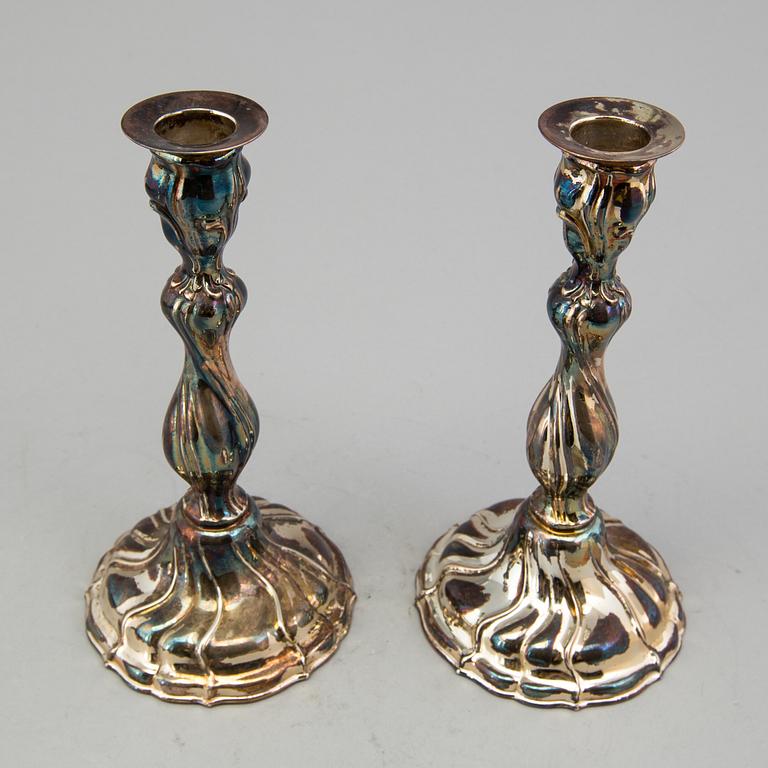 A pair of candlesticks, Swedish importmarks, mid 20th century.