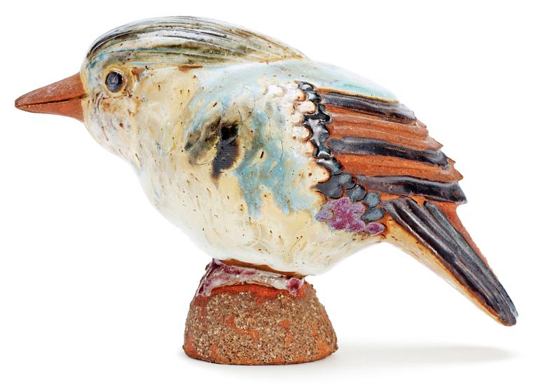 A Tyra Lundgren stoneware bird, signed with a seal.