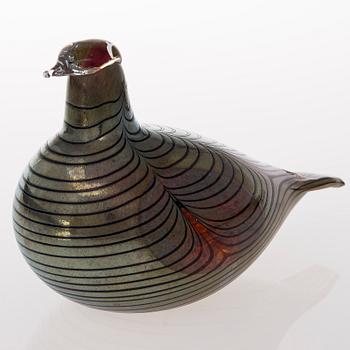 A glass bird, signed O. Toikka Nuutajärvi.