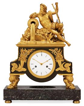 661. A French Empire early 19th Century mantel clock.