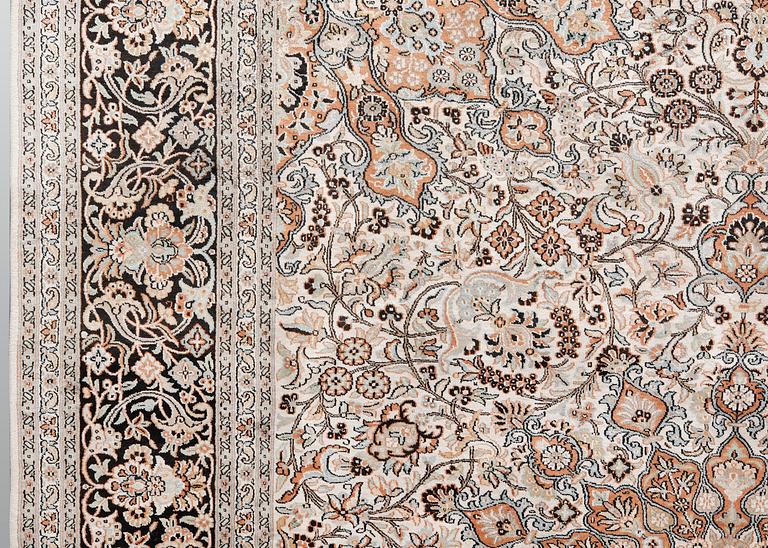 A silk Kashmir carpet, ca 330 x 246 cm.