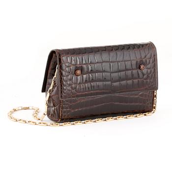 CÉLINE, a brown crocodile evening bag / shoulder bag with  shoulder strap.