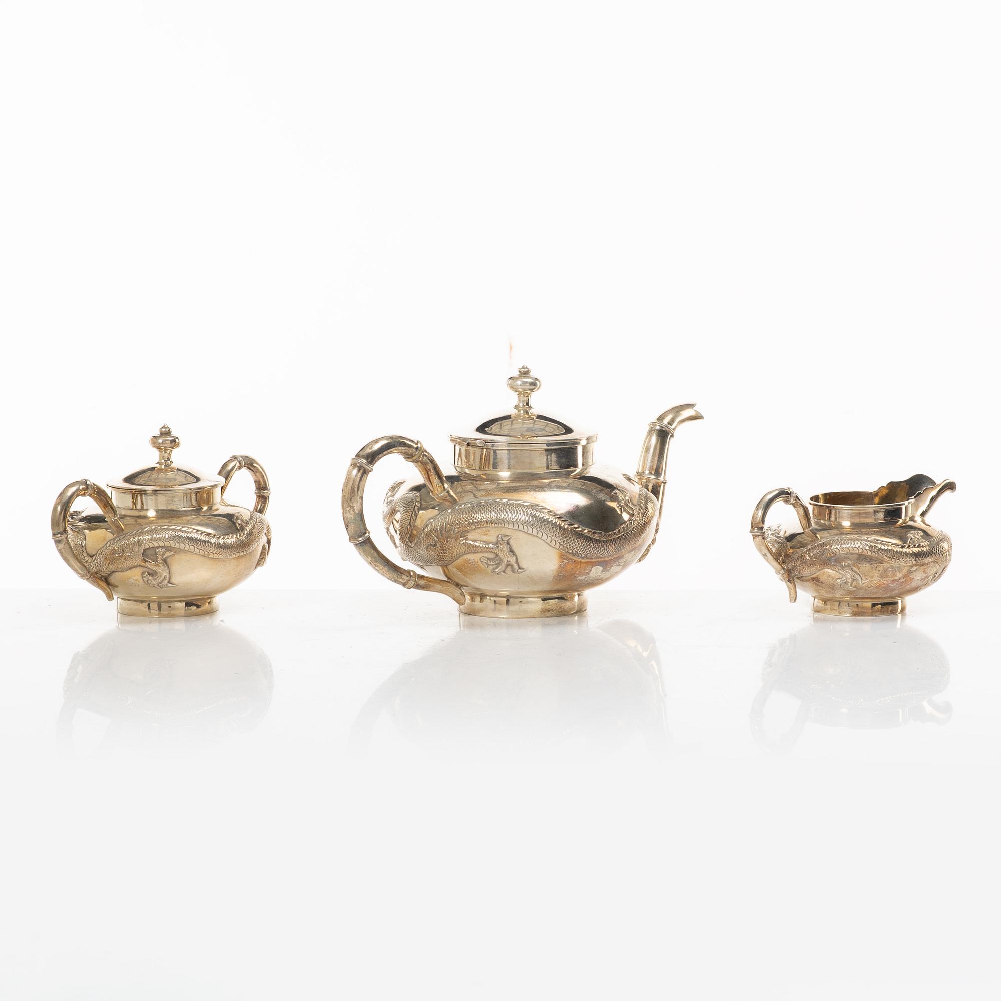A three-piece Chinese silver tea service, Shanghai, early 20th Century.