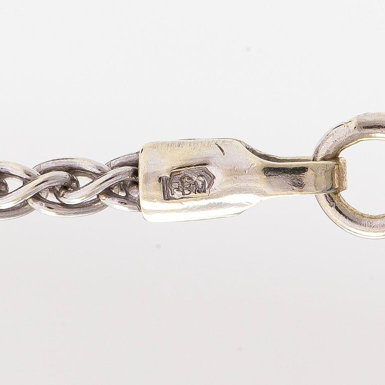 Necklace/pendant, cross, 14K white gold with diamonds totalling approx. 0.25 ct. Finnish hallmarks.