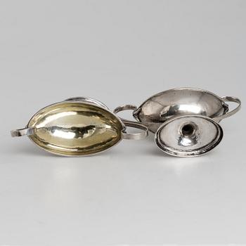 A pair of firt half of the 19th century parcel-gilt silver salt-cellars by an uknown master, one marked HB.