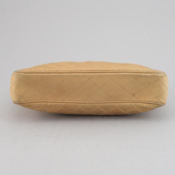 Chanel, a beige leather handbag, 1986-1988.