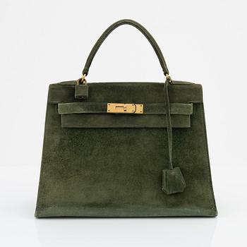 Hermès, a 1960's green suede 'Kelly 30'.