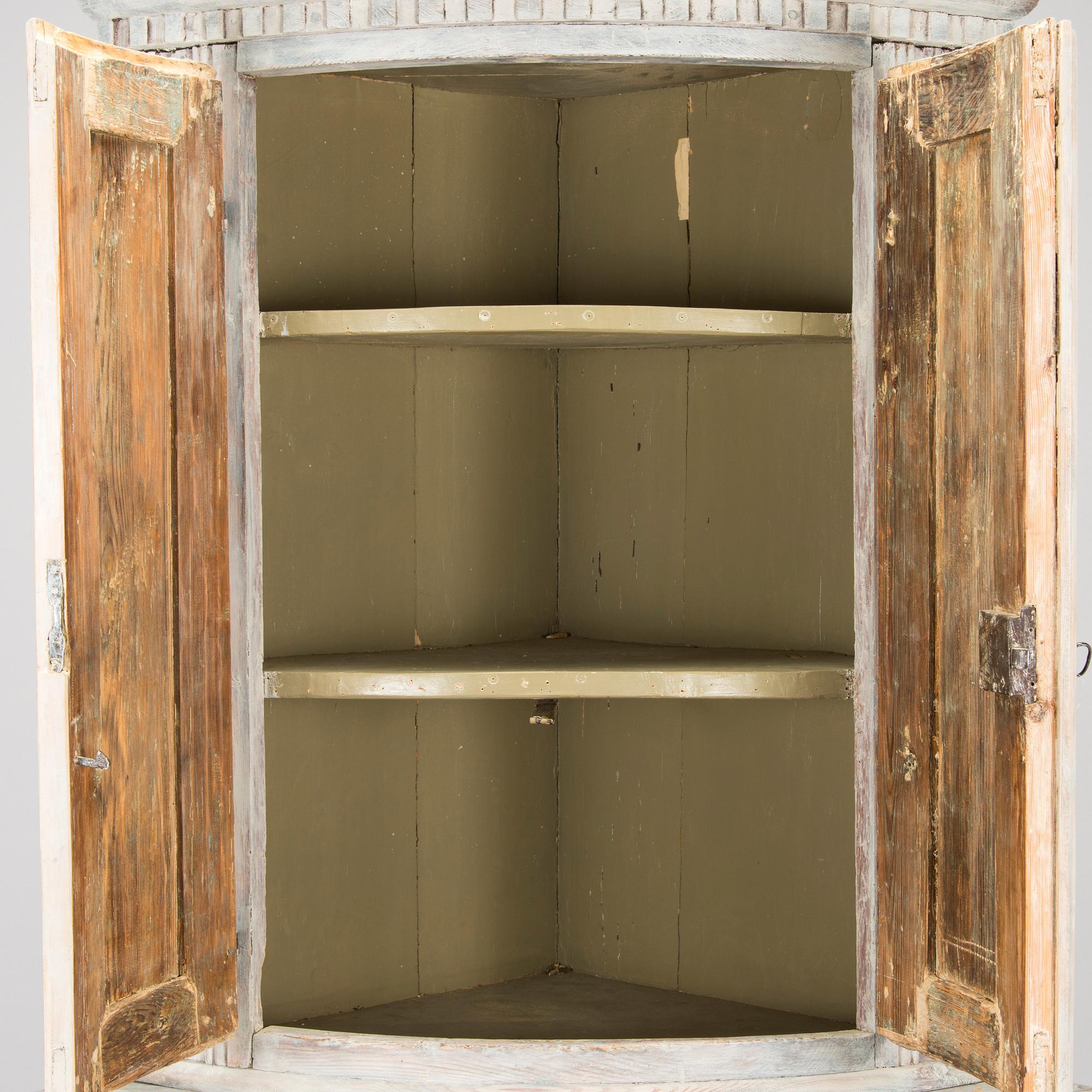 A Swedish Gustavian corner cabinet, circa 1800.