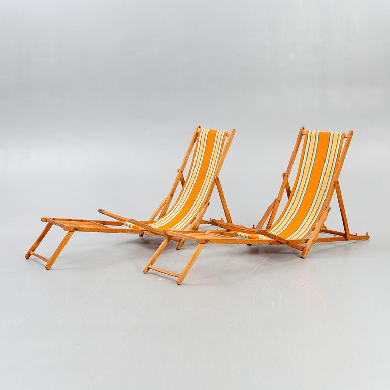 Sun loungers, a pair of footstools, 1950s.