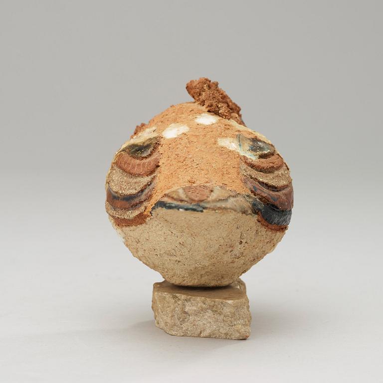 A Tyra Lundgren stoneware sculpture of a bird.